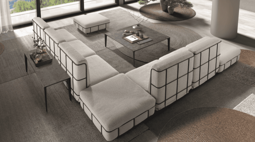 Vista desde atrás de sofá de diseño junto con mesa - disponible en Mobles Álvarez en Terrasa