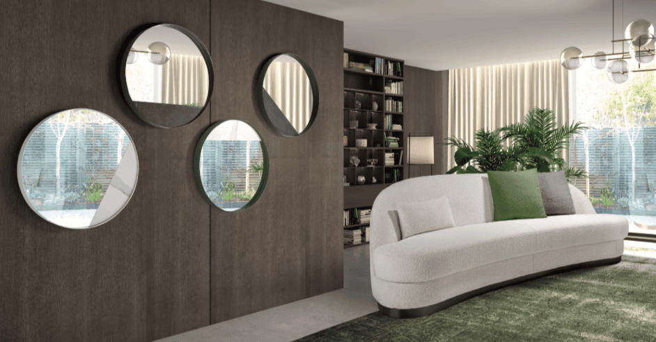 Vista completa de salón con espejos en la pared y sofá de diseño - disponible en Mobles Álvarez en Terrasa